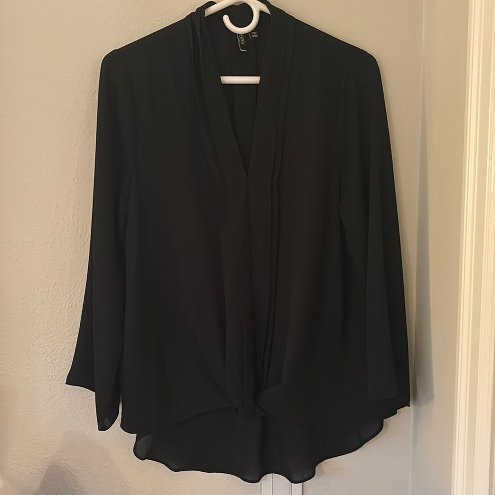 Black long sleeve top with gathering of fabric at front